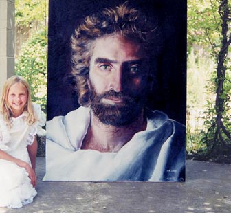 Akiane with her portrait of Jesus Christ